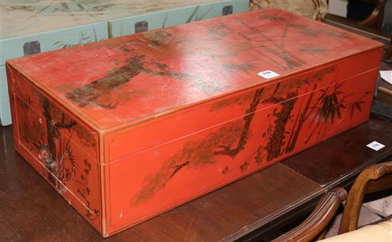 A Chinese red lacquer trunk with gilt bamboo decoration